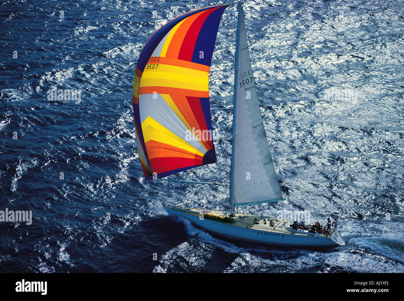 Australia.  New South Wales coast. Aerial side view of ocean going yacht with spinnaker sail during race. Rampant II. Stock Photo
