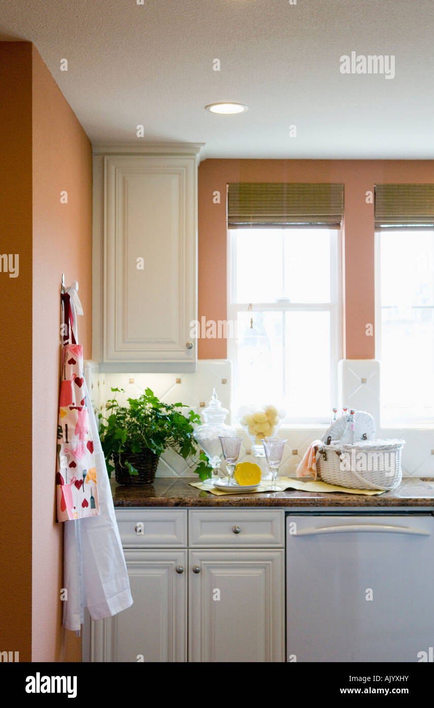 Aprons hanging on a kitchen wall Stock Photo Alamy
