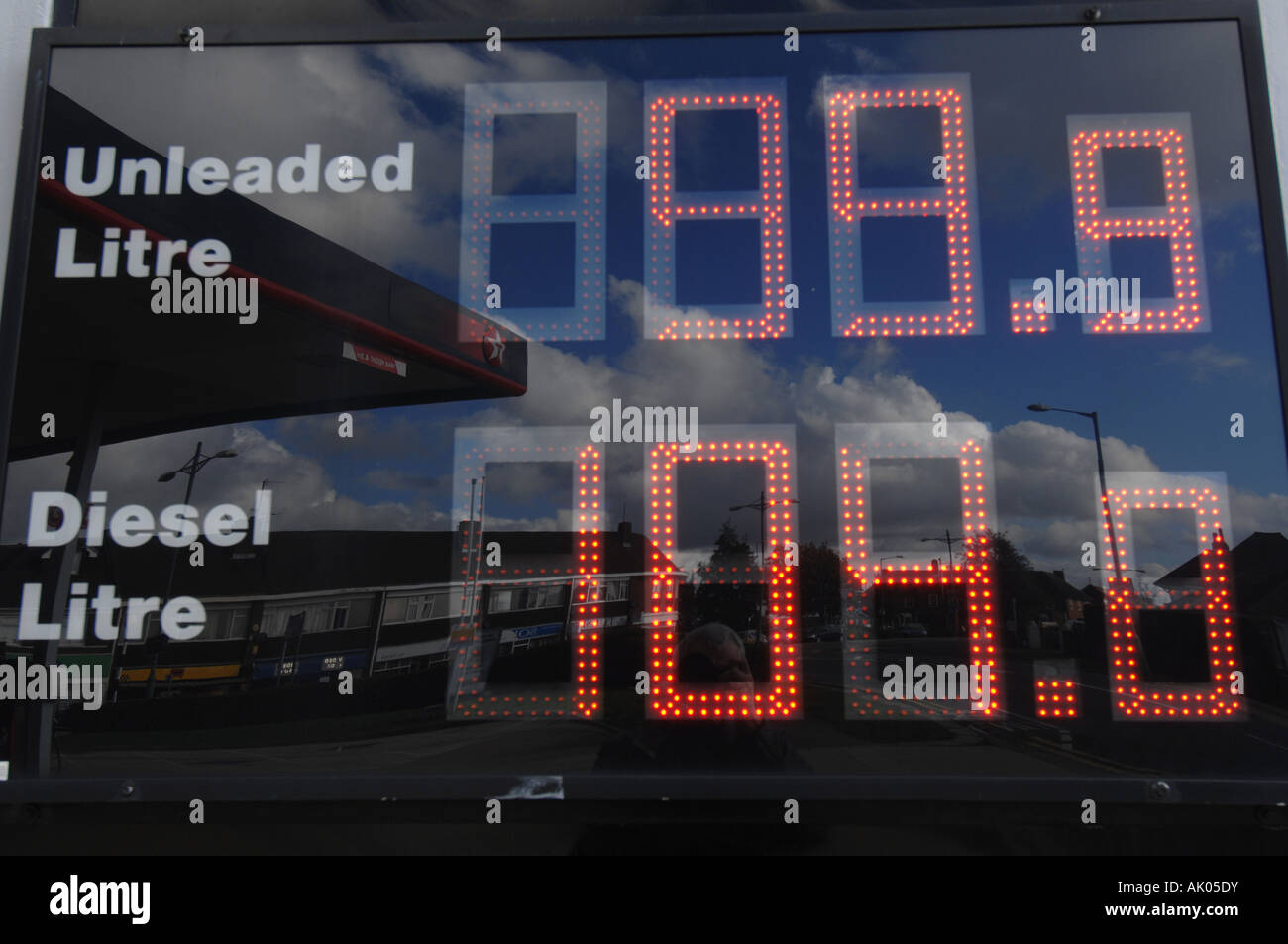 Fuel prices displayed on petrol pumps at 99.8p petrol and 89p diesel Stock Photo