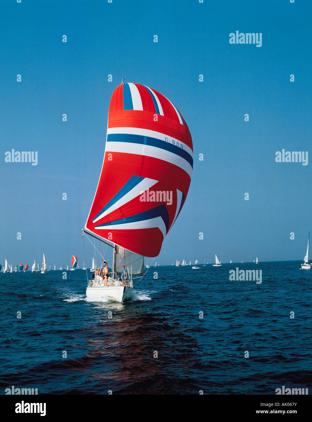 Yacht with spinnaker sail. Stock Photo