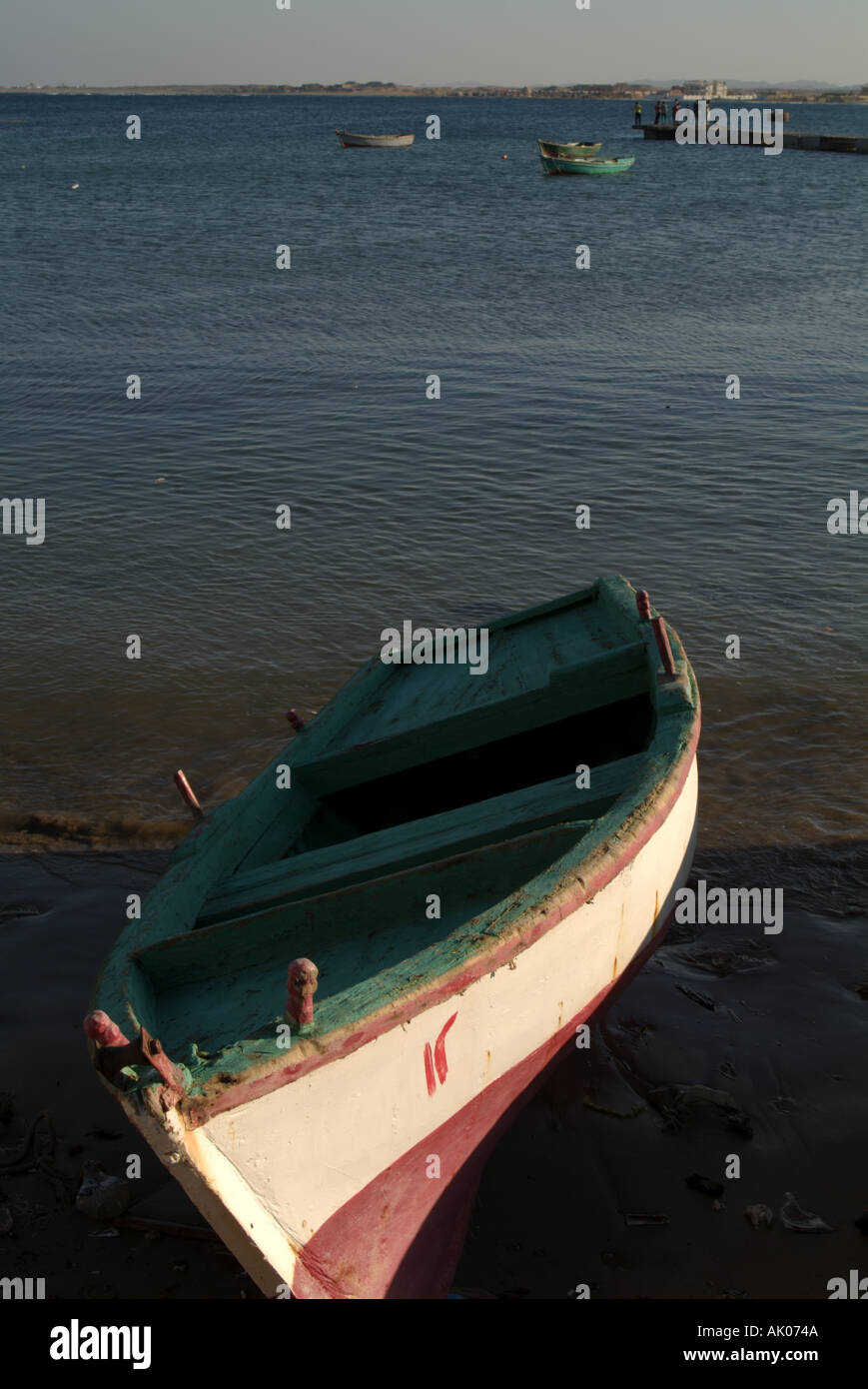 Egypt red sea quoseir village a small fisherman boat on the beach at ...