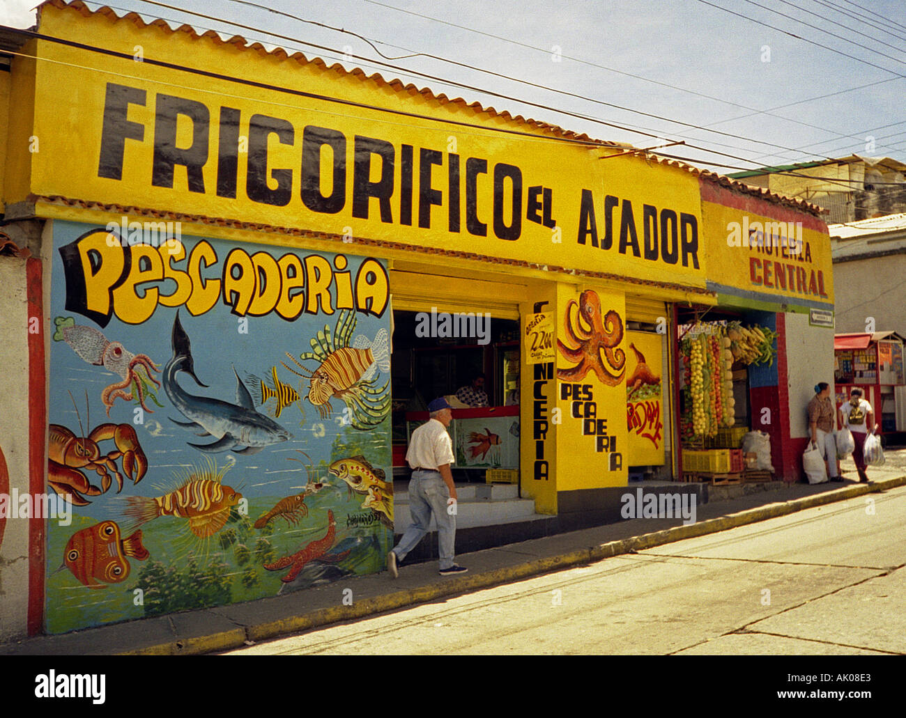Traditional typical colourful paint draws yellow colonial fish fruit vegetables shop Merida Venezuela South Latin America Stock Photo