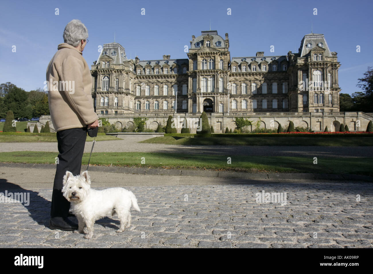 UK England County Durham,Barnard Castle,The Bowes Museum,1869 French style chateau,European art collection,woman female women,dog,pet,canine,animal,UK Stock Photo
