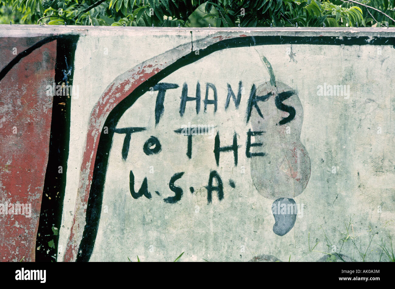 An old thank you sign pertaining to the USA s invasion in 1983 on a fence in a village in the remote mountains of Grenada Stock Photo