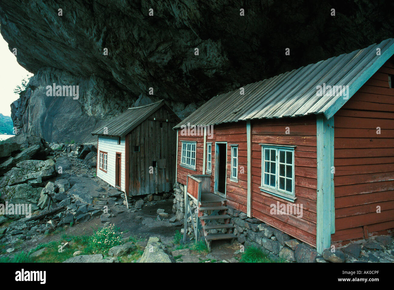 Houses under ledge / Haeuser unter Felsvorsprung Stock Photo