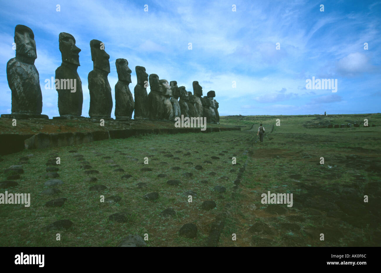 Tourist walking by Moai Easter Island Chile Stock Photo
