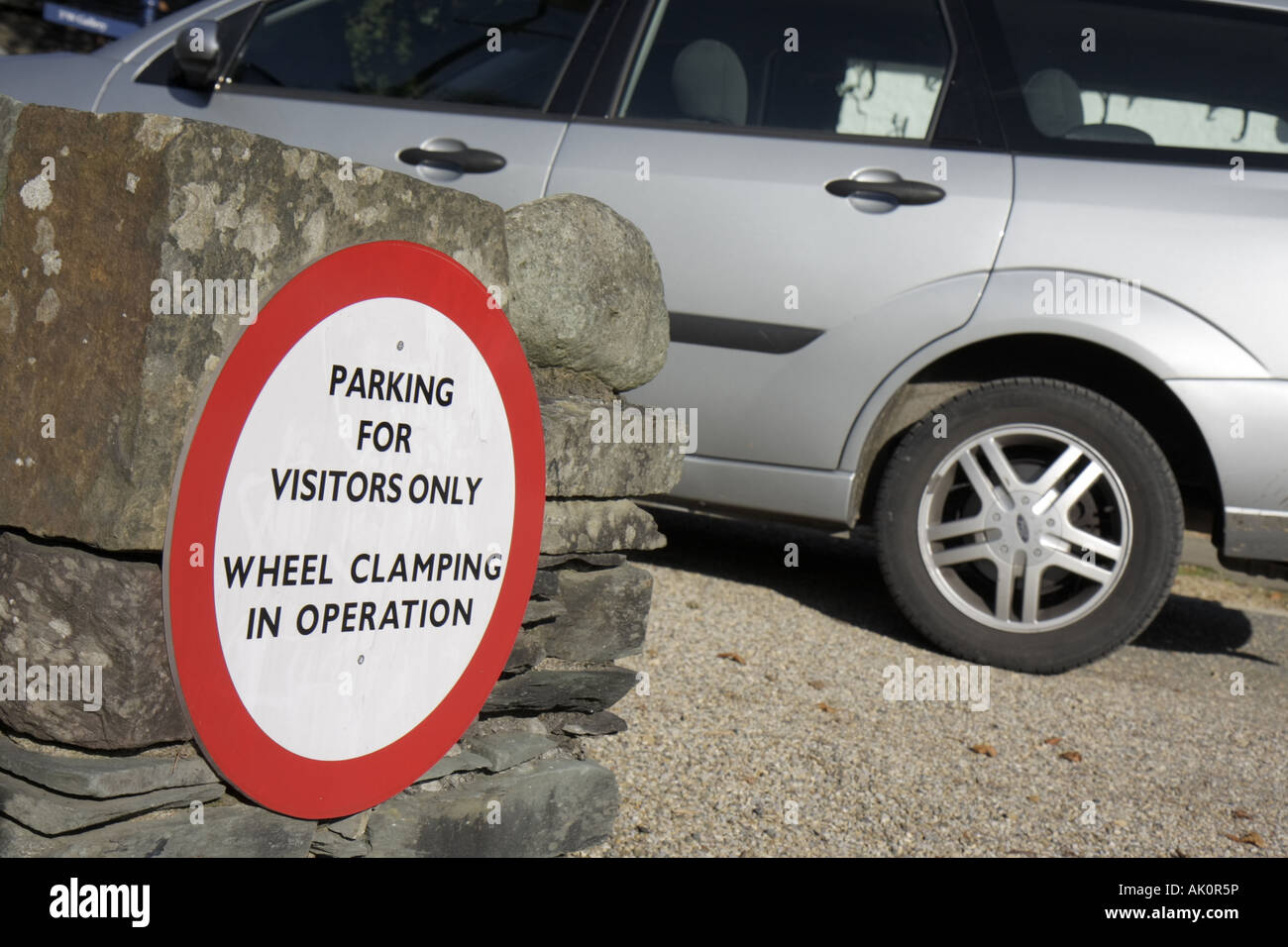 UK England Cumbria,The Lake District,Grasmere,sign,wheel clamping,parking,UK071010040 Stock Photo