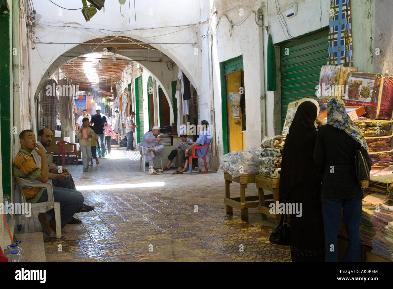 Tripoli, Libya. Street Scene, Covered Market, Women in Abayas on right