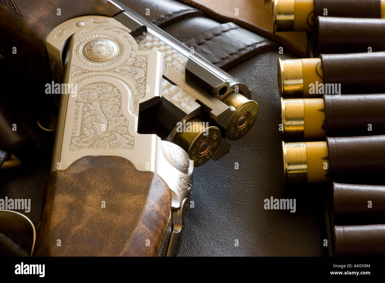 Loaded over and under shotgun and cartridges Stock Photo - Alamy