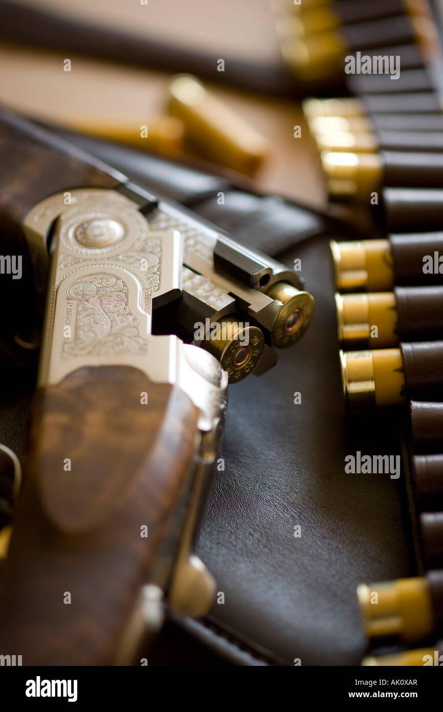 Open loaded over and under shotgun and cartridges Stock Photo - Alamy