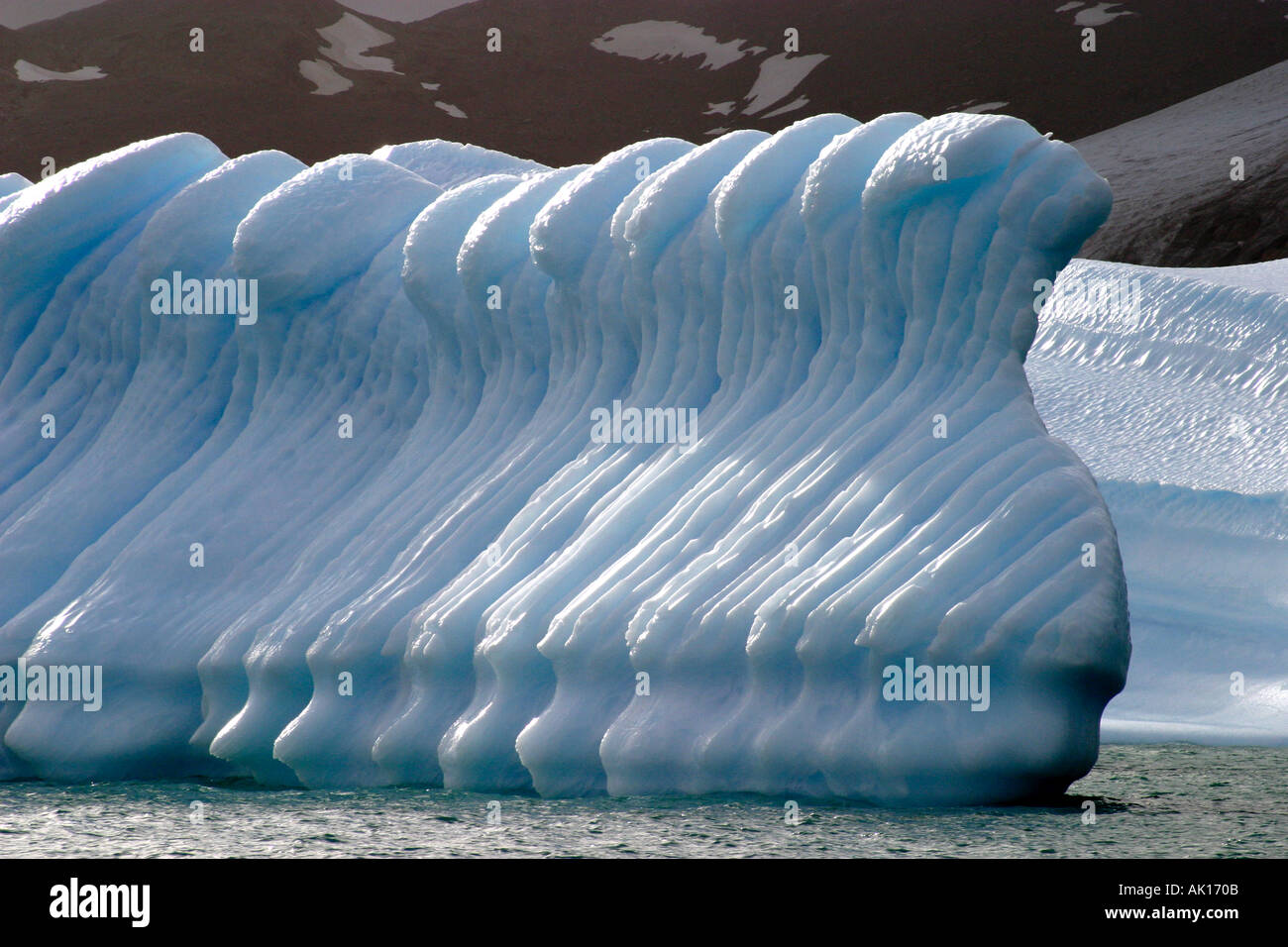 Exquisitely molded iceberg like a line of soldiers on parade,Antarctica, Stock Photo