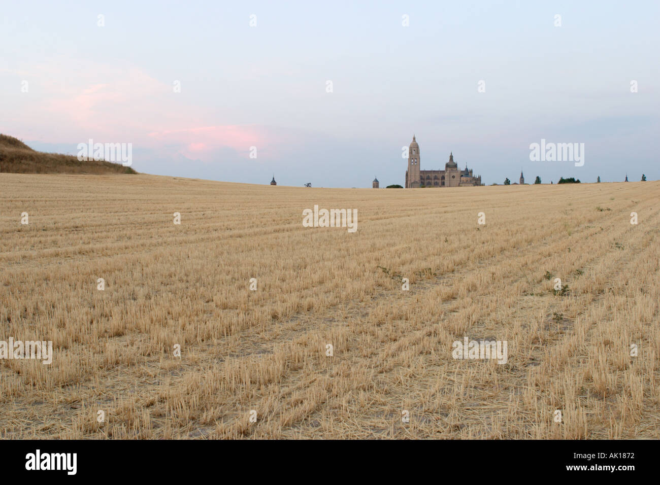 Landscape at sunset with Segovia Cathedral in the distance, Castilla y Leon, Spain Stock Photo