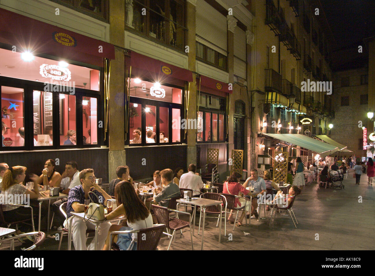 Sidewalk cafes and bars at night in the city centre, Madrid, Spain