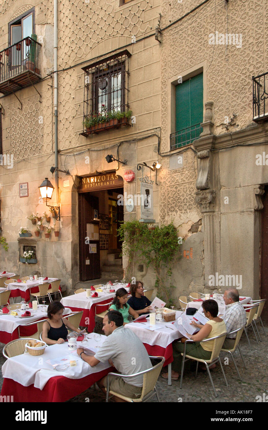 People sitting outside a restaurant in the old town in the early evening, Plaza de San Martin, Segovia, Castilla y Leon, Spain Stock Photo