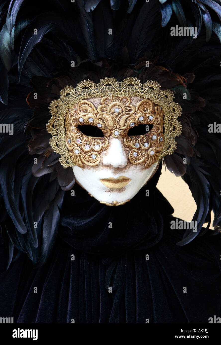 A masked figure outside a mask shop in Venice Stock Photo - Alamy