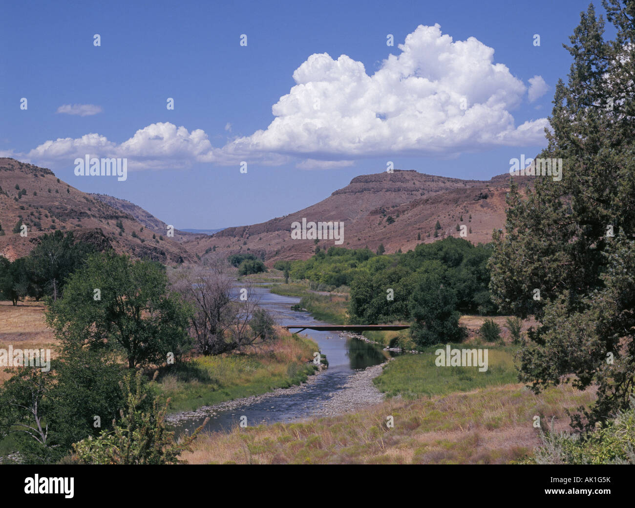 A view of summer clouds over the hills and the mesas in the ranch country of the John Day River Stock Photo