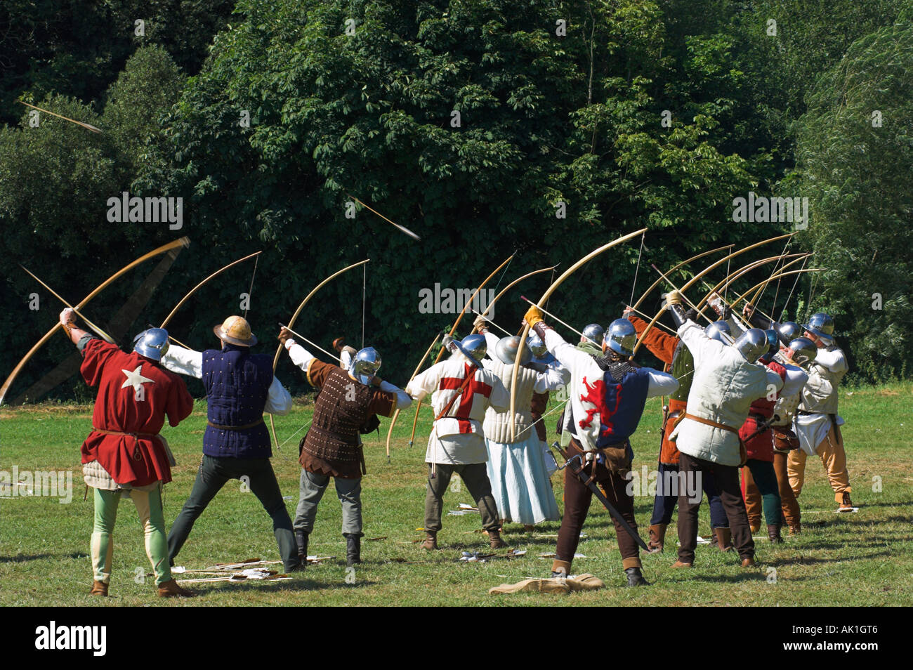 Medieval longbow archers reenacting the siege of Berkeley Castle with shooting of voiles of arrows Stock Photo