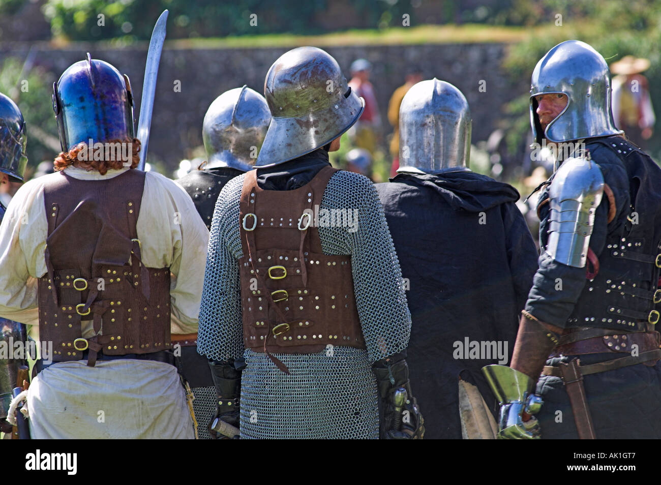 Group of man in suits of armour ready to do battle at medieval reenactment Stock Photo