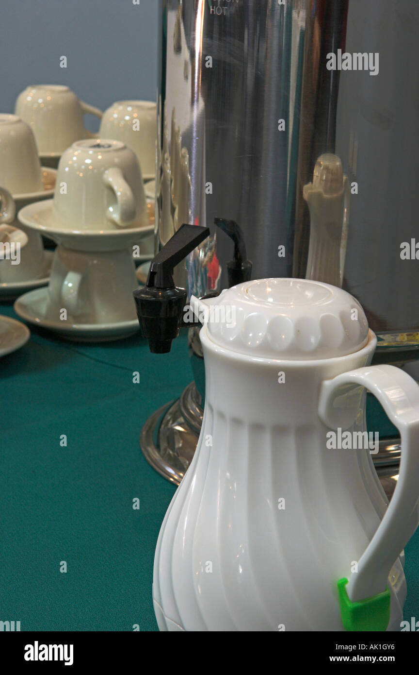Stacked coffee cups saucers with coffee pot for meeting Stock Photo Alamy