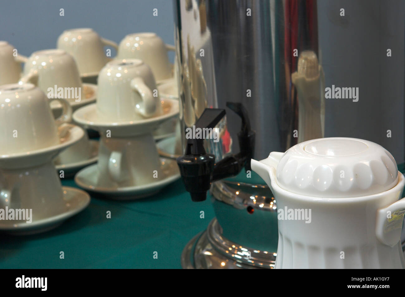 Stacked coffee cups saucers with coffee pot for meeting Stock Photo Alamy