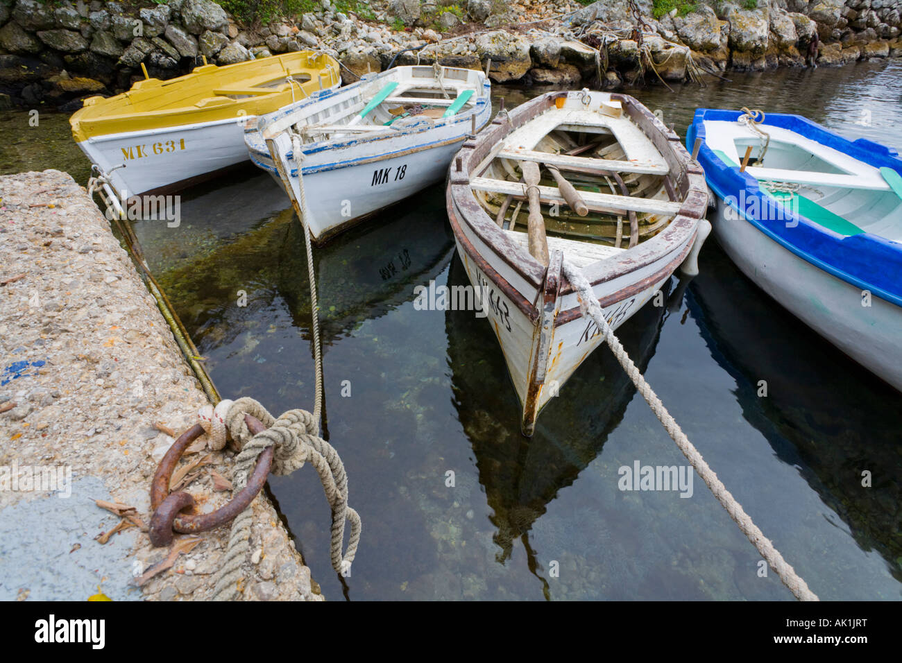 Traditional wooden boats mooted in port, Glavotok on Krk in Croatia Stock Photo