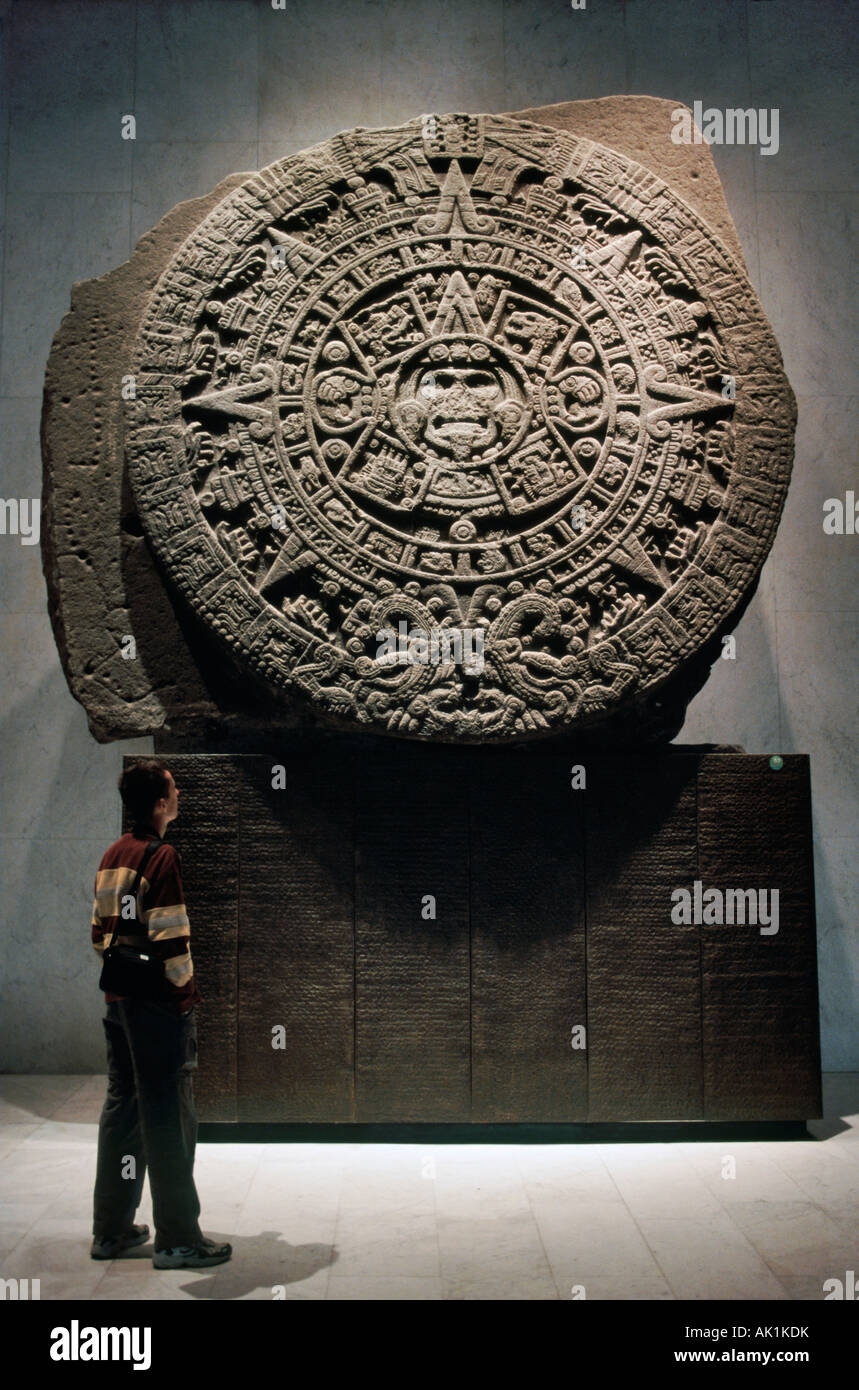 Visitor looking at Aztec Calendar at Museo Nacional de Antropologia in Mexico City Stock Photo