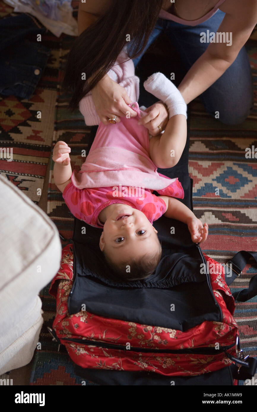 parent changing toddler diaper Stock Photo Alamy