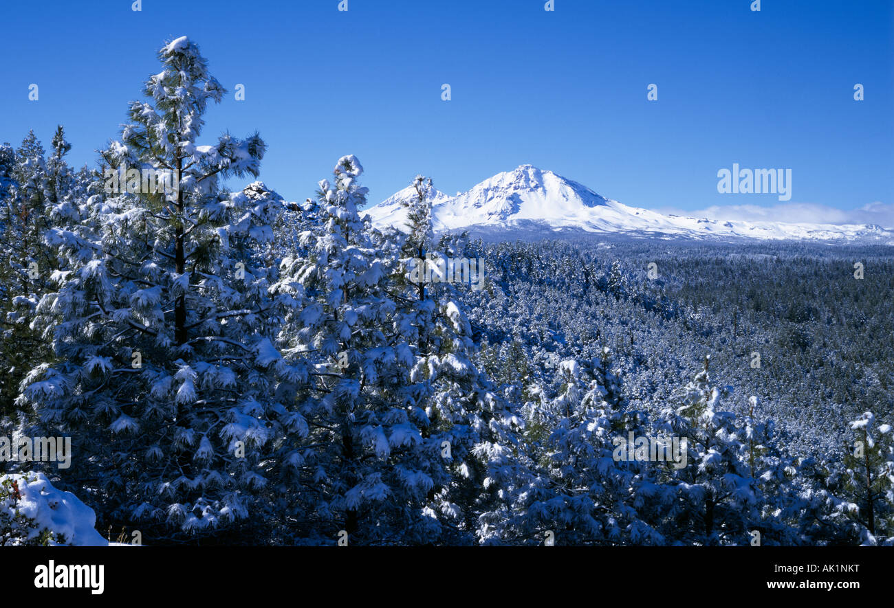 A view of the snow covered Sisters peaks in the middle of winter in the Cascade Mountains near the town of Sisters Oregon Stock Photo