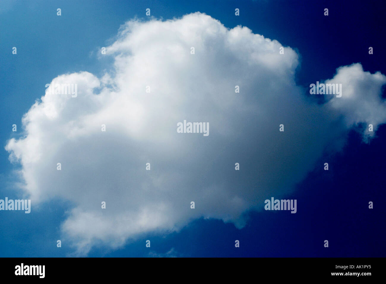 Single White Fluffy Cloud Against Deep Blue Sky Hi res Stock single-white-fluffy-cloud-against-deep-blue-sky-hi-res-stock