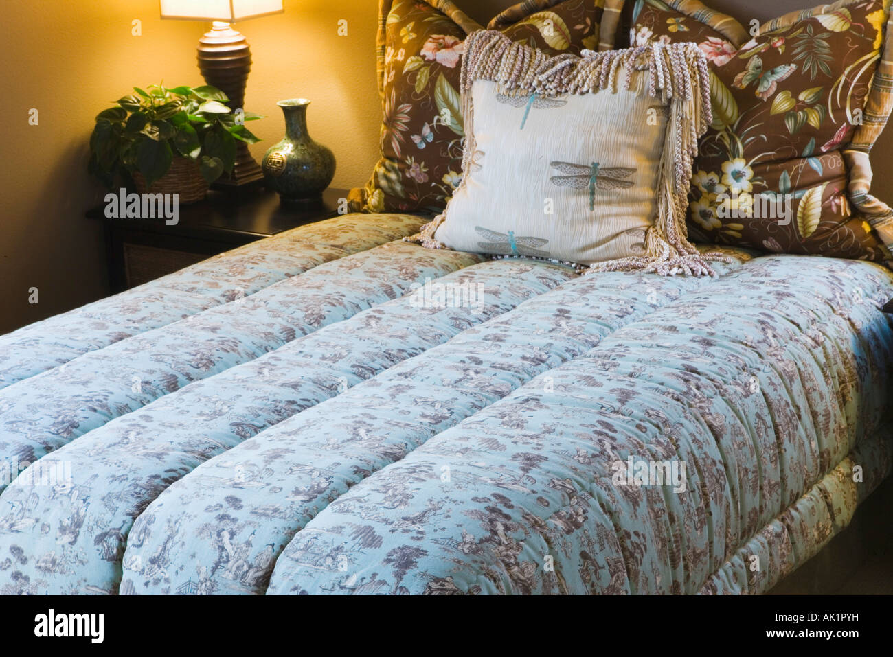 Comfortable Double Bed with Comforter Stock Photo Alamy
