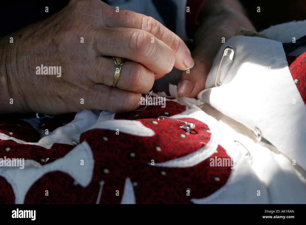 Lady hand sewing quilt hi-res stock photography and images - Alamy