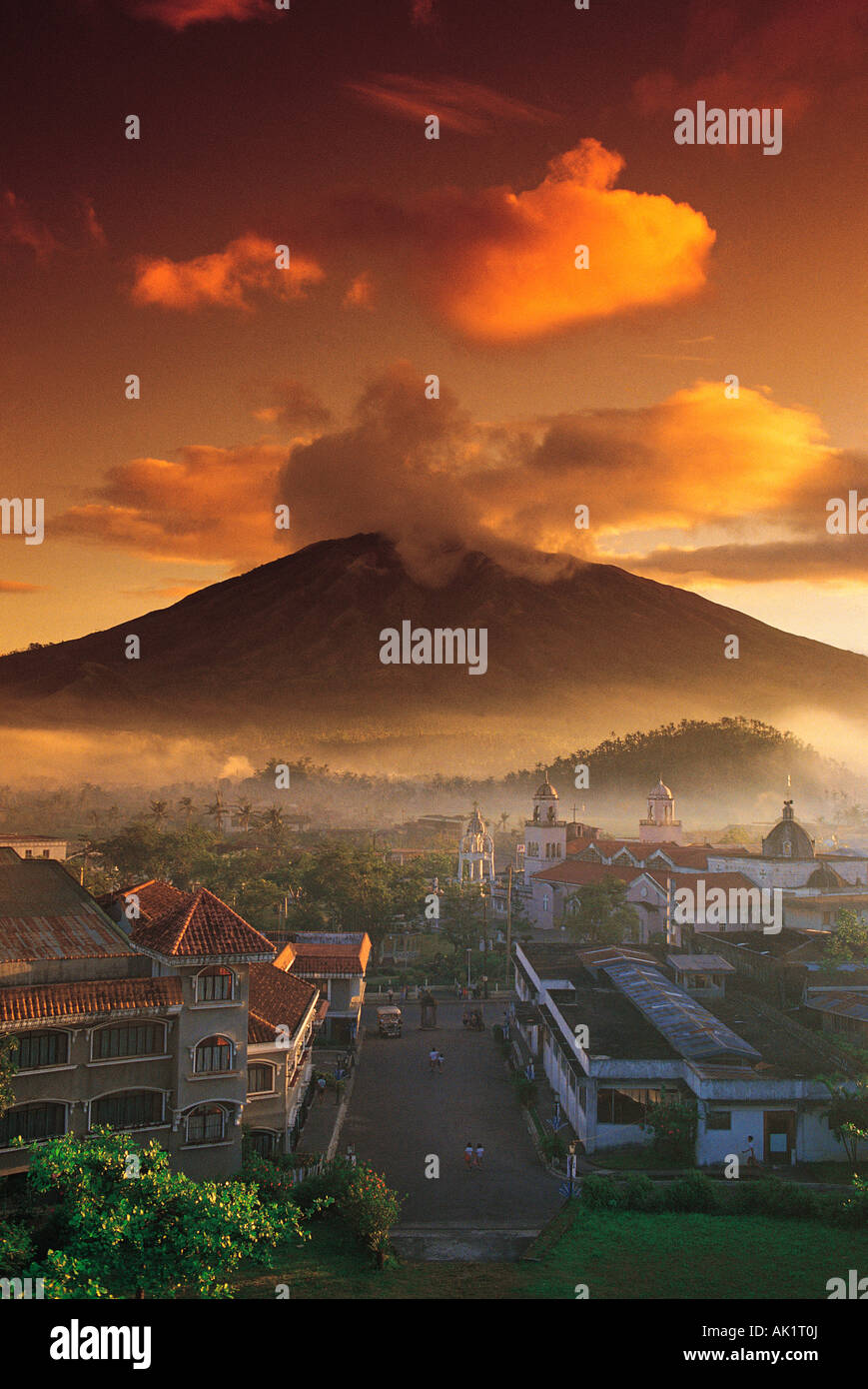 Philippines. Luzon Island. Sunrise over volcano and city. Stock Photo
