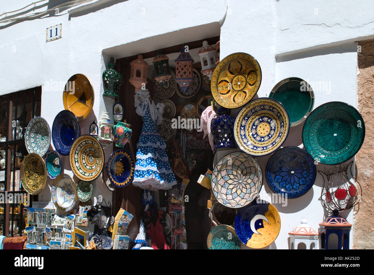 Plates on the wall outside a pottery shop, Ronda, Andalucia, Spain Stock Photo