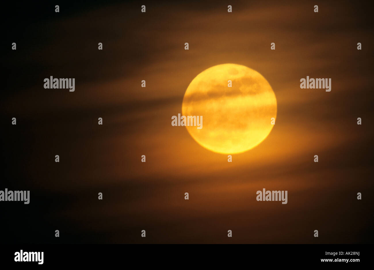 moon behind clouds Stock Photo Alamy
