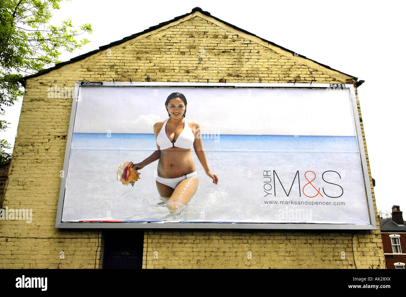 mylene klass marks and spencer advertising billboard advert end house gable  end terrace manchester bikini woman female celebrity Stock Photo - Alamy