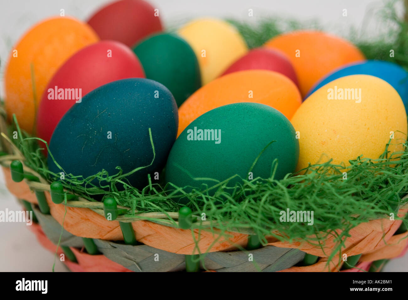 Dyed eggs lying in an easter basket Stock Photo