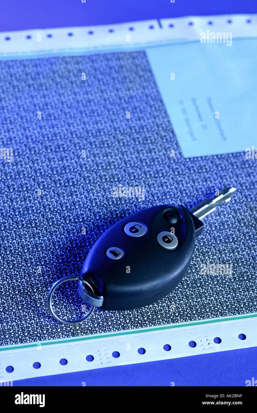 Pay slip with car keys Stock Photo