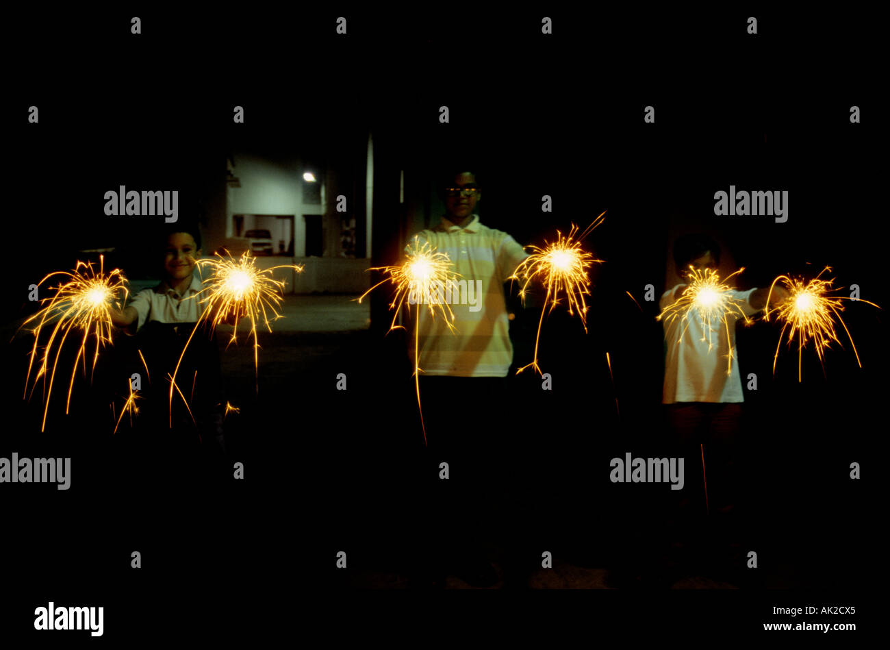Children enjoying sparkles during Diwali in Mumbai, India. Stock Photo