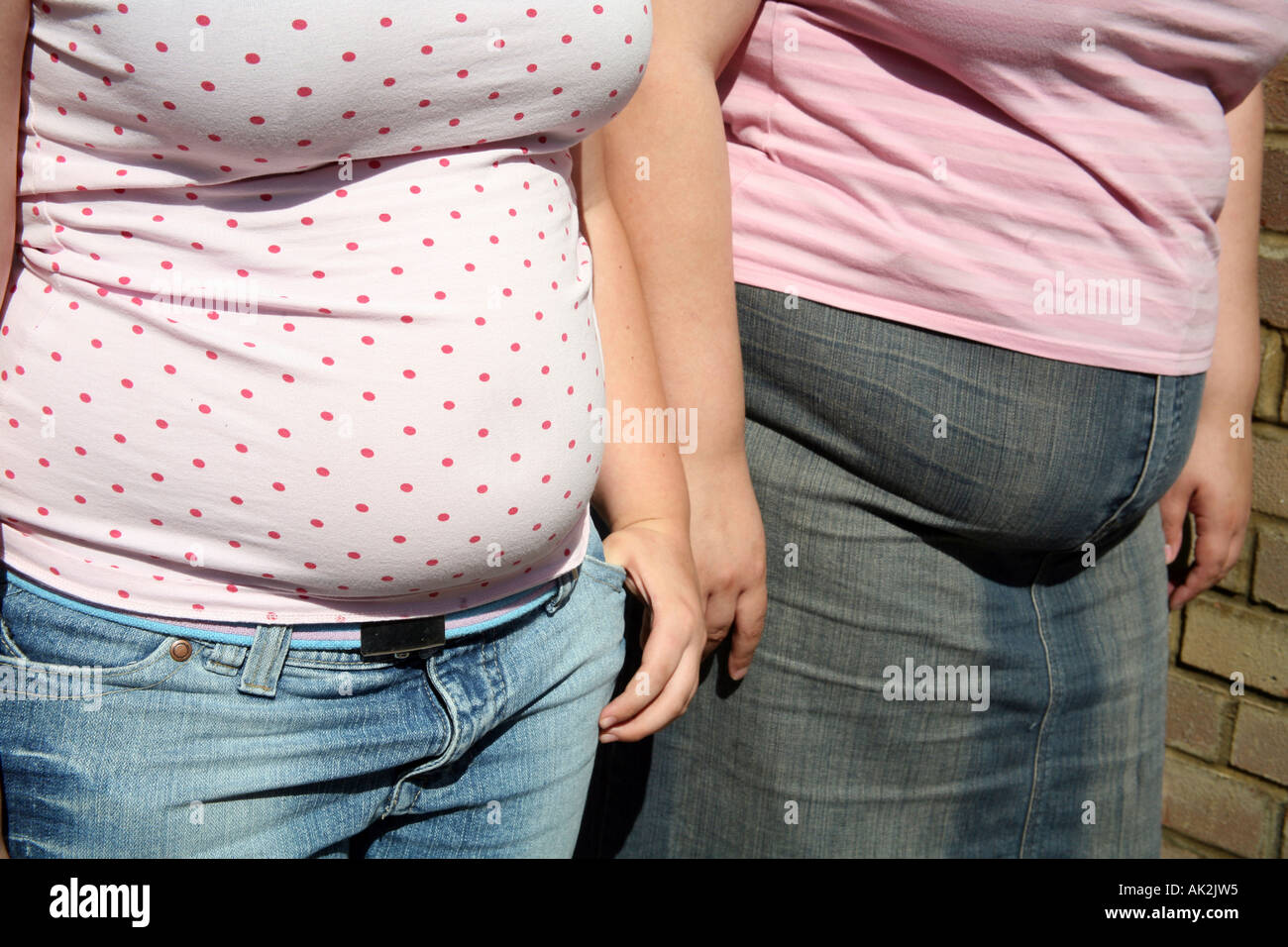 close up of 2 fat tummies Stock Photo