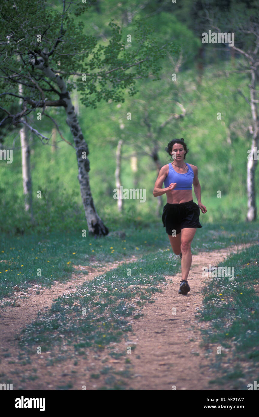 Woman trail running Stock Photo - Alamy