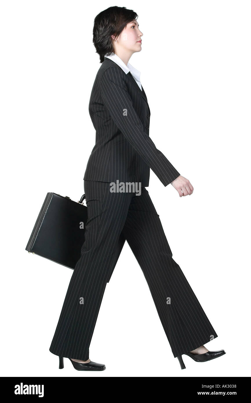 Woman in black walking hi-res stock photography and images - Alamy