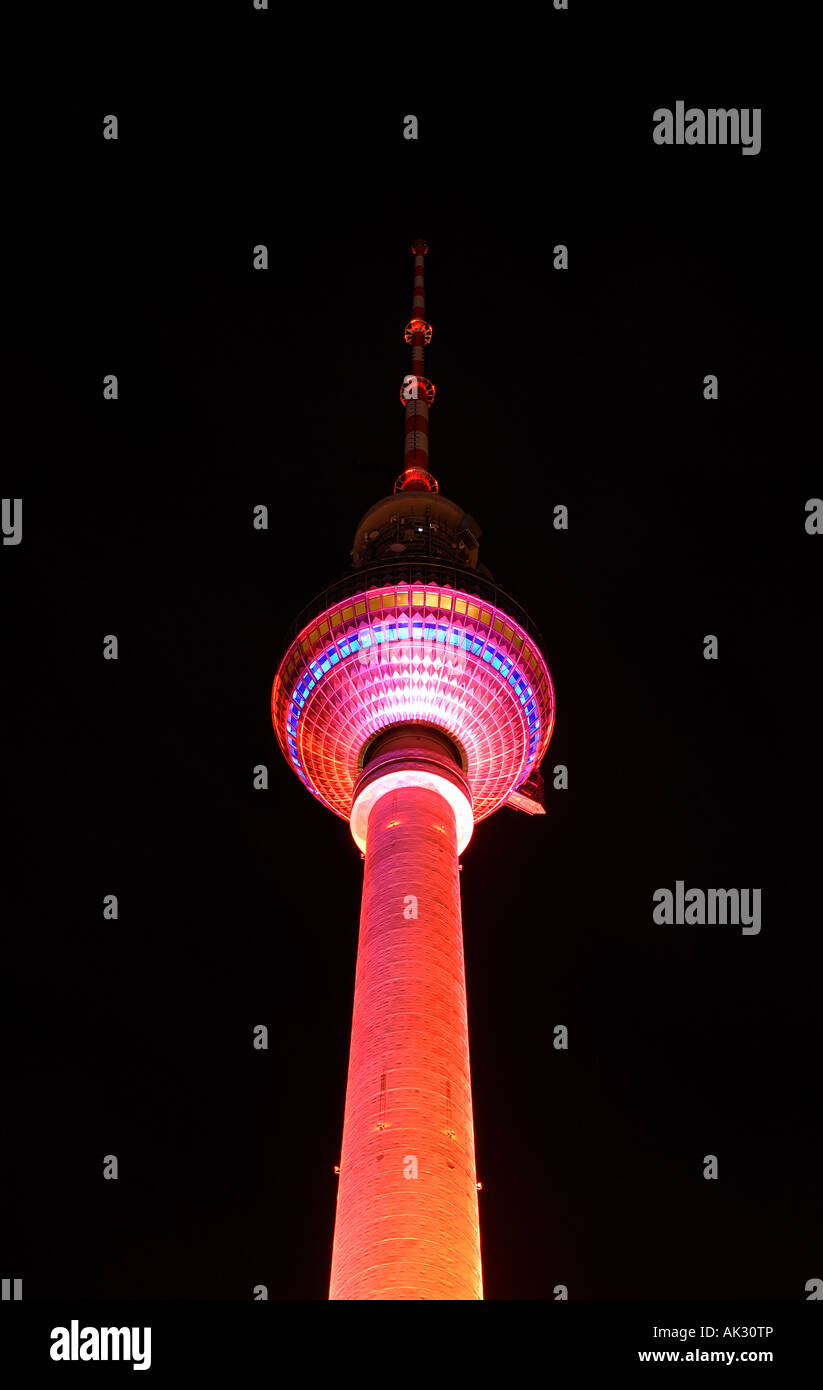 Berlin Television Tower colourfully illuminated at night Stock Photo