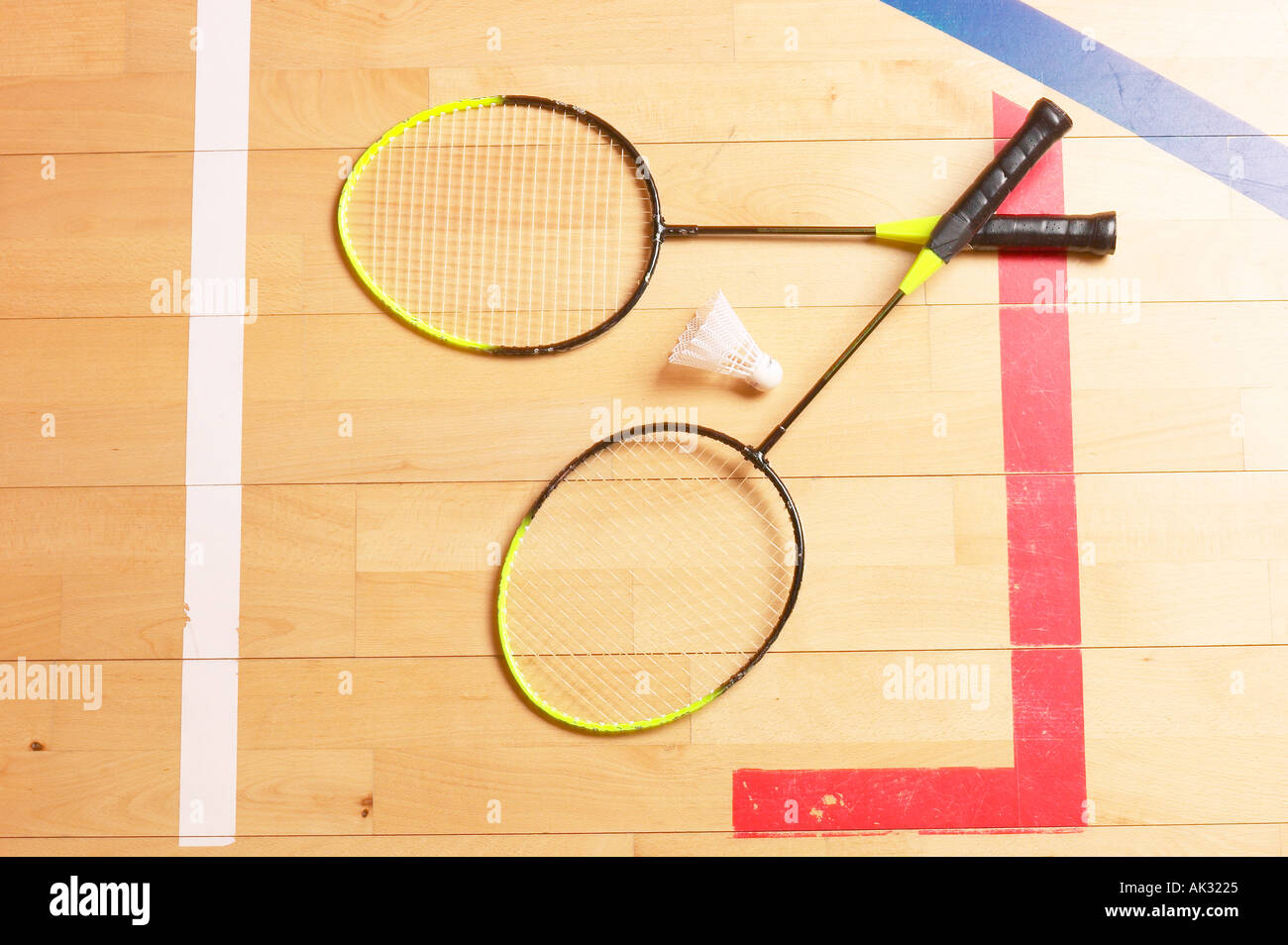 Badminton equipment on gym floor Stock Photo - Alamy