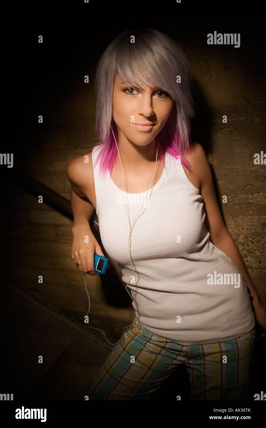 Teenage girl listening to portable music player Stock Photo Alamy