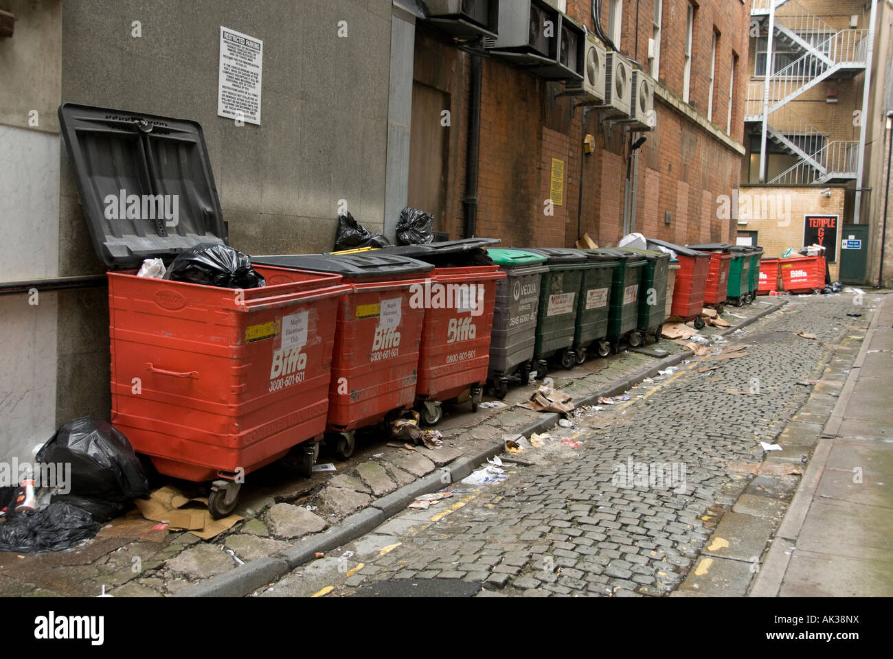 rubbish containers in a street in birmingham used as commercial bins
