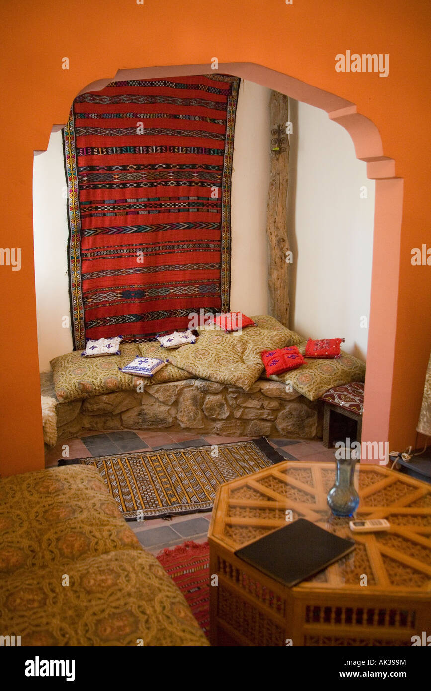 Colorful Moroccan interior with Persian carpets and cushions, Marrakesh