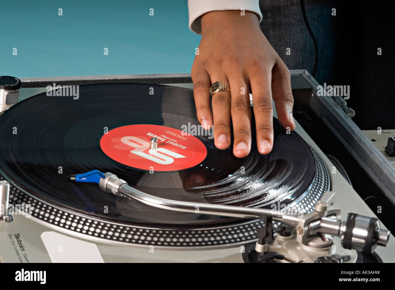 a dj mixing records on some decks Stock Photo