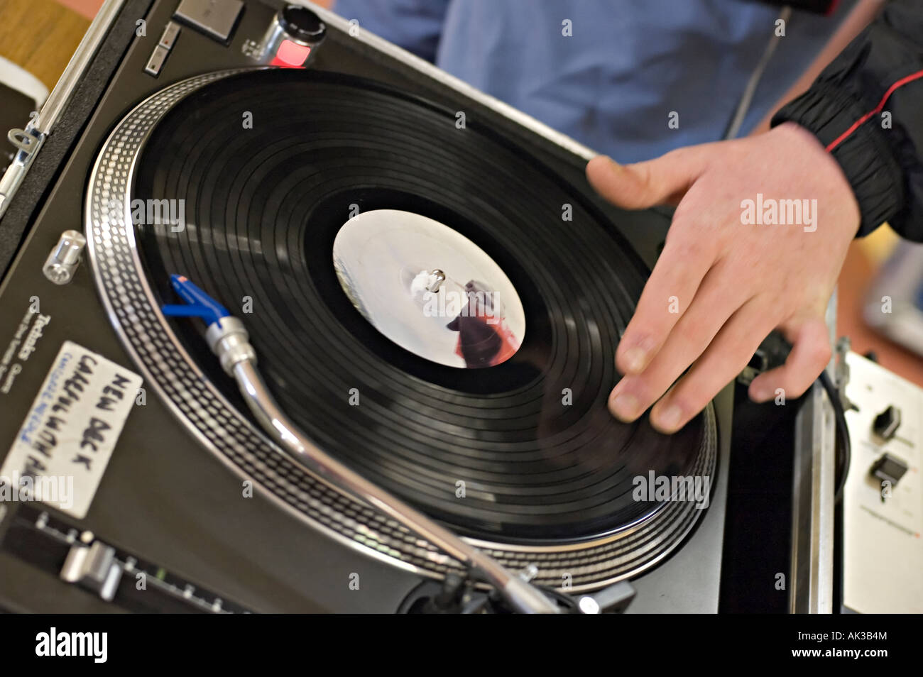 a dj mixing records on some decks Stock Photo