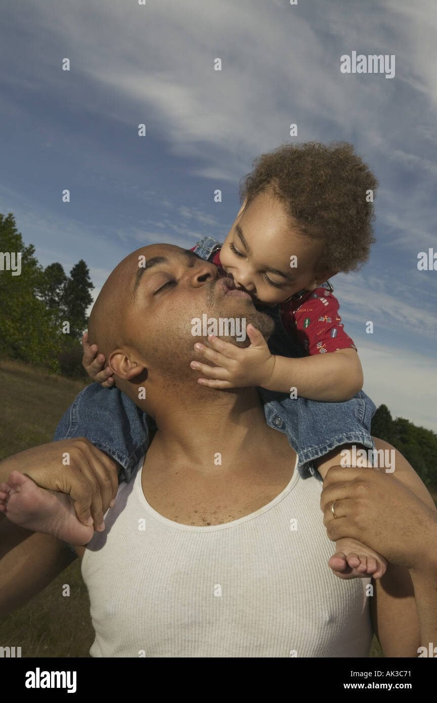 A father kissing his son Stock Photo