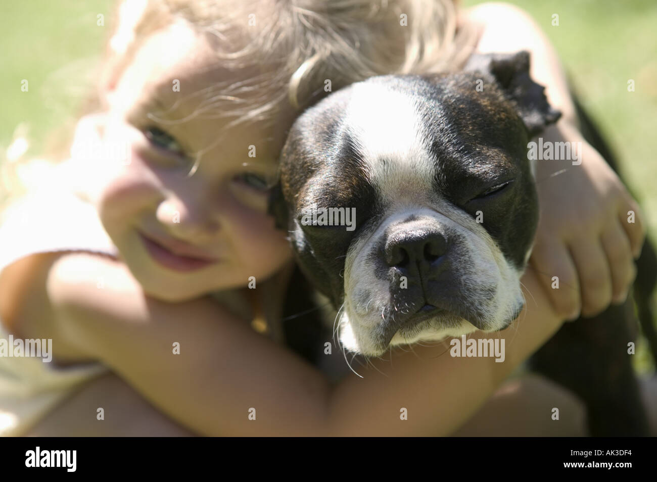 Young girl hugging her dog Stock Photo